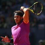 Rafael Nadal of Spain in action against Novak Djokovic of Serbia