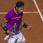 Rafael Nadal of Spain reacts after winning a point against Fabio Fognini of Italy